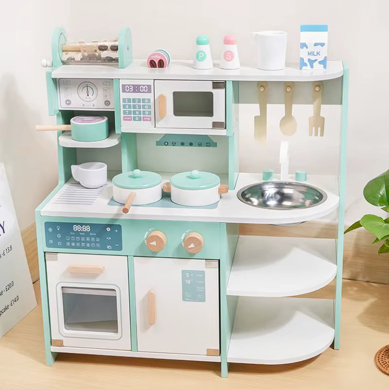 Children's play kitchen set with various utensils and appliances on a light wooden floor.