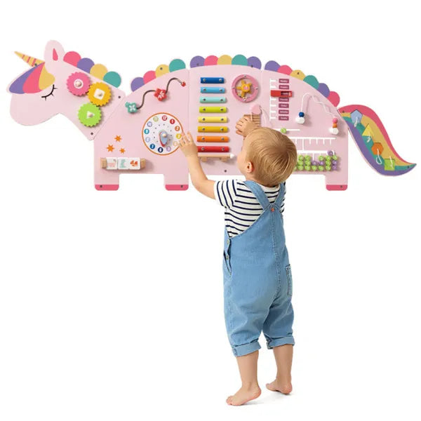 Child playing with a colorful unicorn-shaped educational toy on a white background