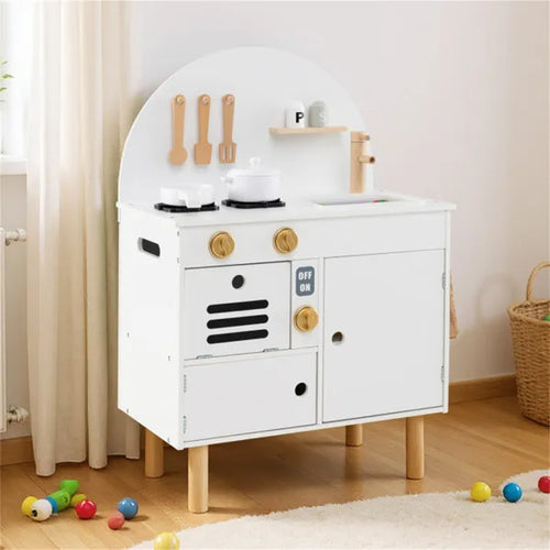 Children's play kitchen set with white stove and wooden utensils on a light wood floor.