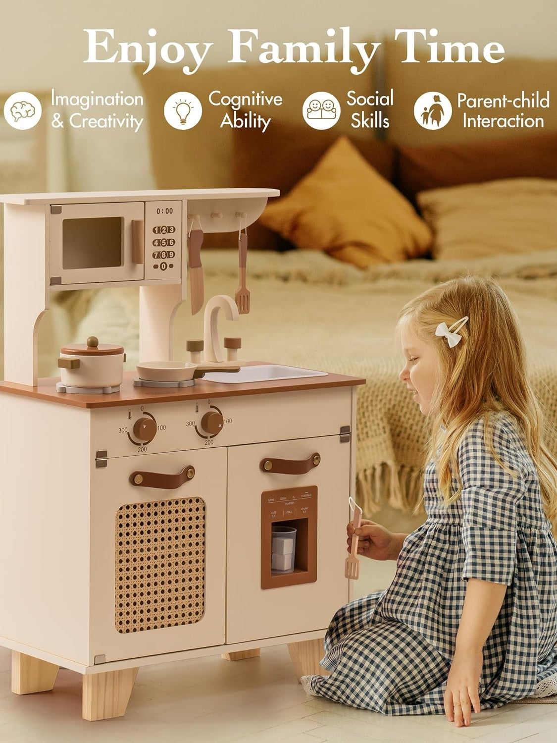 Child playing with a toy kitchen set in a cozy room.