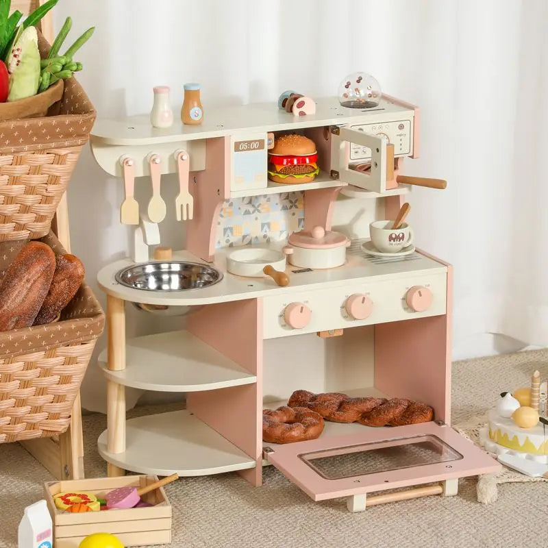 Children's play kitchen set with various accessories on a light-colored floor.