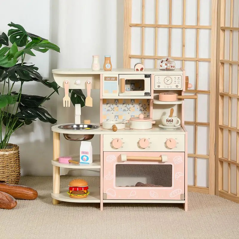 Children's wooden play kitchen set with various accessories in a room setting.