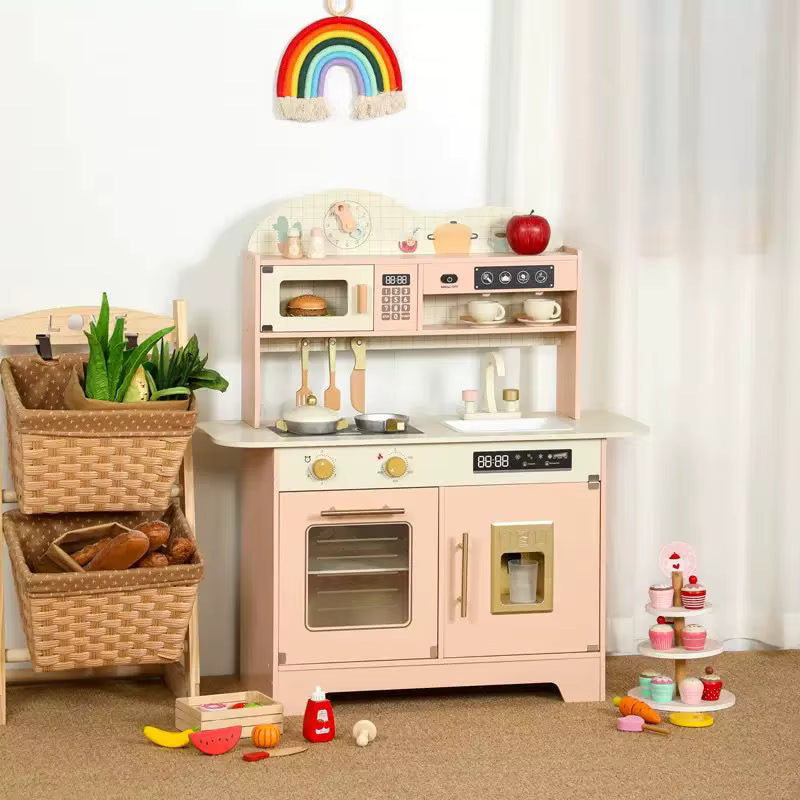 Children's play kitchen set with toy food and utensils in a room setting.