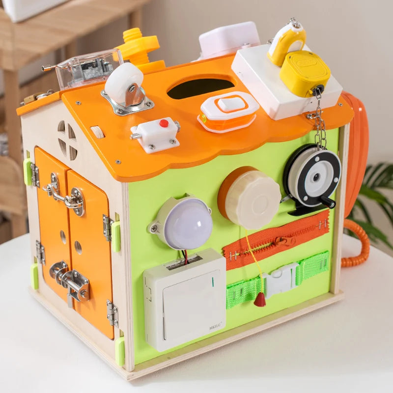 Colorful wooden toy with various mechanical components on a white surface.