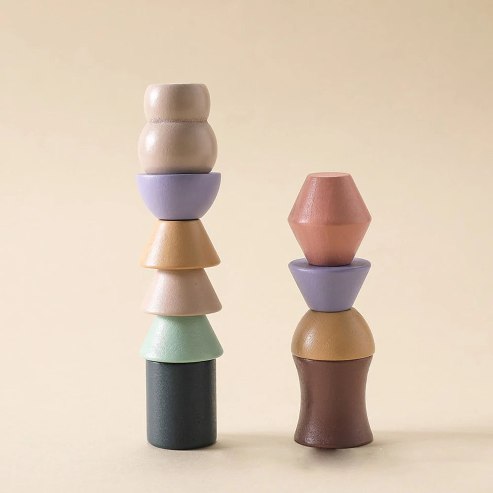 Two stacks of colorful ceramic vessels on a beige background