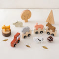 Set of wooden animal toys on a white background