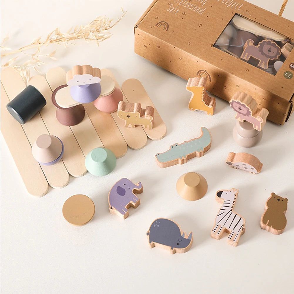 Set of wooden toys with animal shapes and a cardboard box on a light background