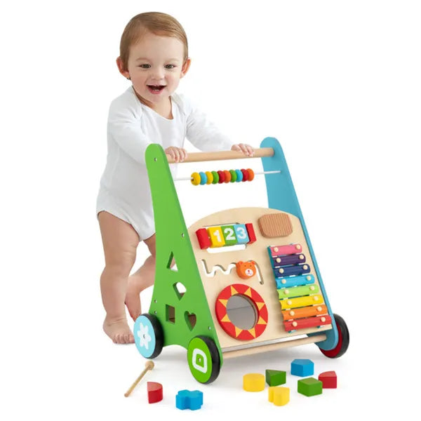 Child playing with a colorful educational toy walker on a white background