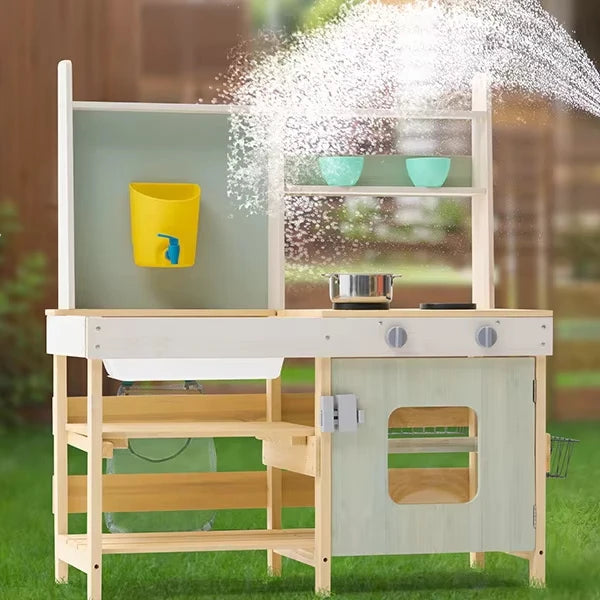 Children's play kitchen set with water pouring effect outdoors