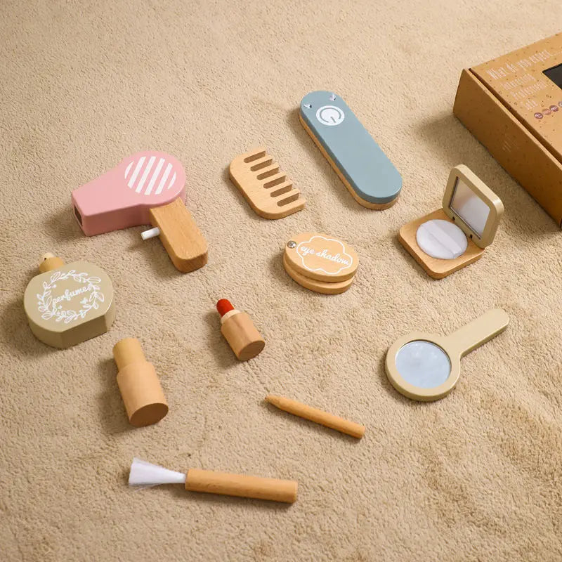 Set of wooden makeup toys on a beige surface