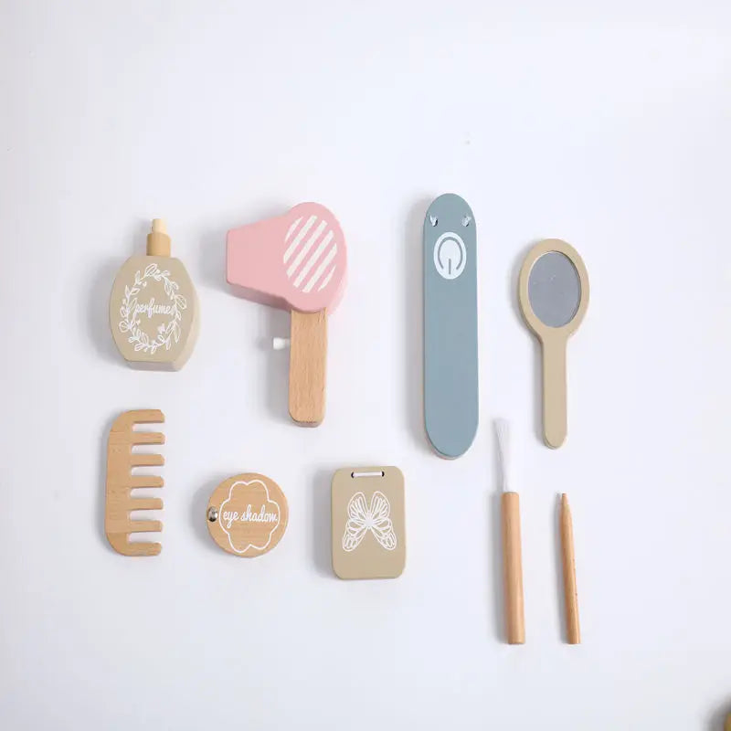 Set of wooden toys resembling grooming tools on a white background