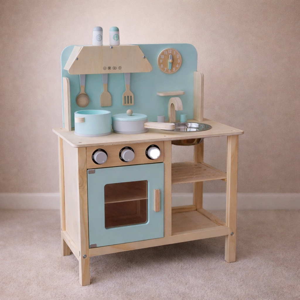 Wooden toy kitchen set with blue and beige colors on a plain background