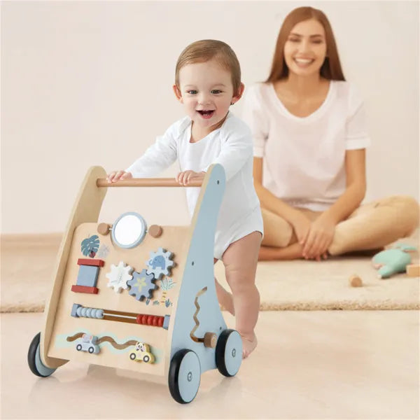 Child playing with a wooden toy while a woman sits nearby on a light-colored floor.