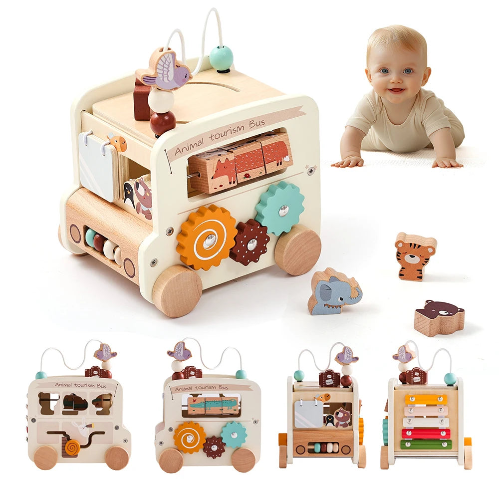 Wooden toy bus with animal figures and a baby crawling on a white background