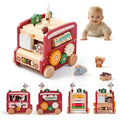 Wooden toy bus with various educational elements and a baby in the background.