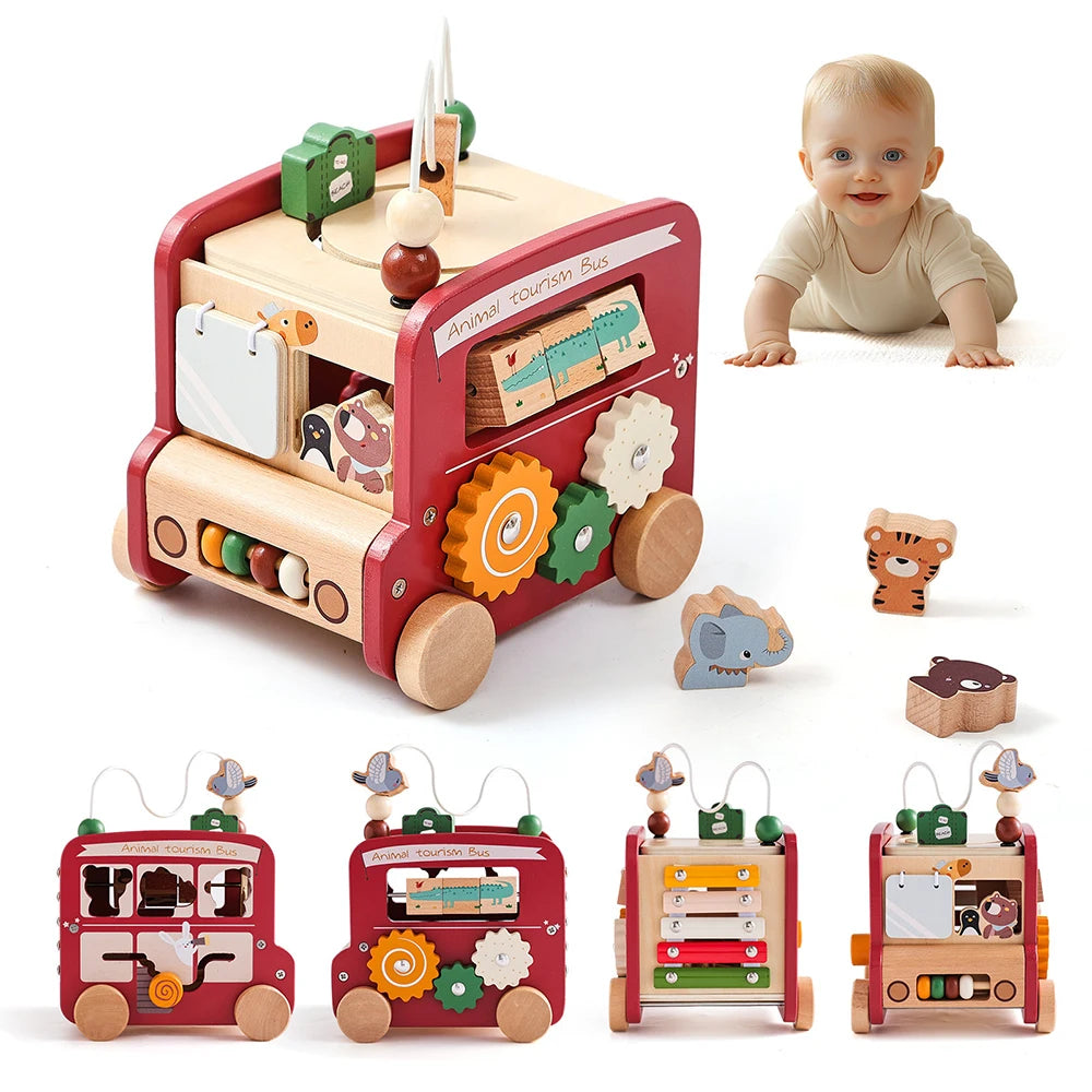 Wooden toy bus with various educational elements and a baby in the background.