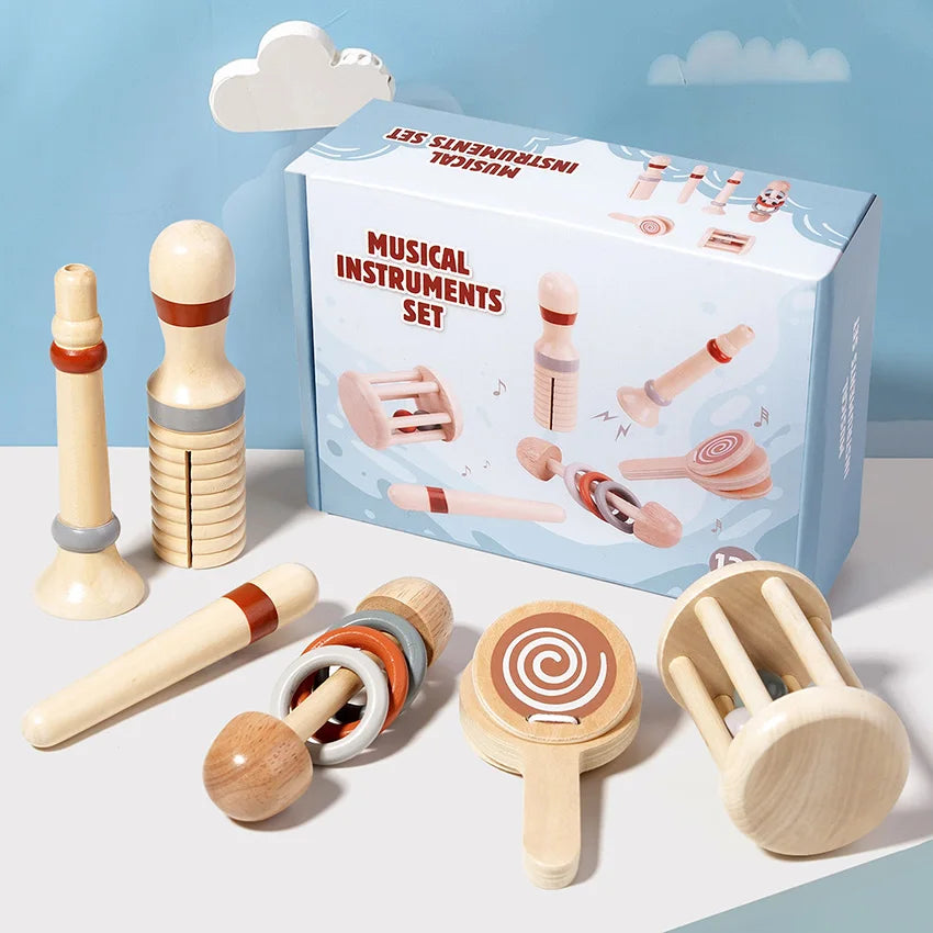 Wooden musical instruments set with packaging on a light blue background
