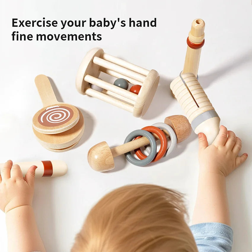 Wooden baby toys with text 'Exercise your baby's hand fine movements' on a white background.